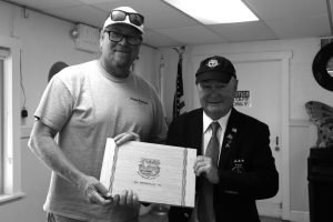 Dinon presents Keith Ives with a second-place award.