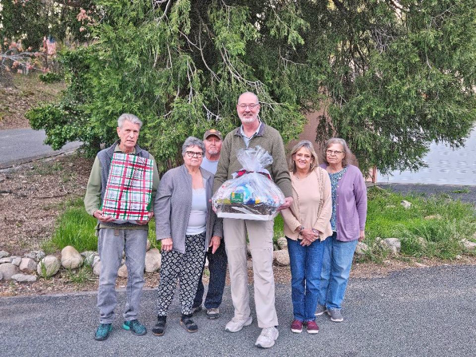Adrianne, Lisa, Julia, Melissa and Adrianna from Glendora and Orange County enjoyed last year’s Brewfest at Tavern Bay Beach Club so much they couldn’t resist attending this year’s event. (Photos by Douglas W. Motley) Group of people with gift basket outdoors.