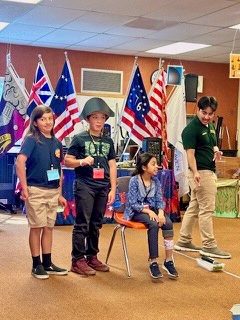 Adrianne, Lisa, Julia, Melissa and Adrianna from Glendora and Orange County enjoyed last year’s Brewfest at Tavern Bay Beach Club so much they couldn’t resist attending this year’s event. (Photos by Douglas W. Motley) Children performing a skit on stage with flags.