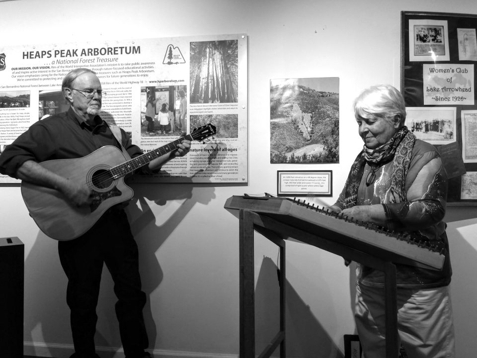 Musicians performing at Heaps Peak Arboretum exhibit.