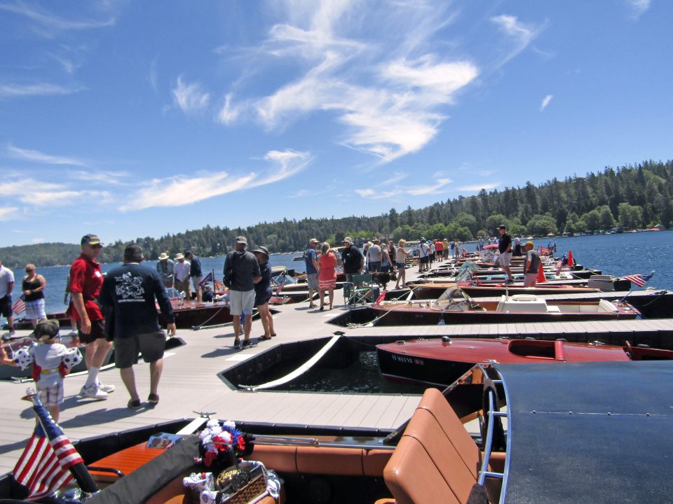 Adrianne, Lisa, Julia, Melissa and Adrianna from Glendora and Orange County enjoyed last year’s Brewfest at Tavern Bay Beach Club so much they couldn’t resist attending this year’s event. (Photos by Douglas W. Motley) Crowd on dock with boats, clear sky.