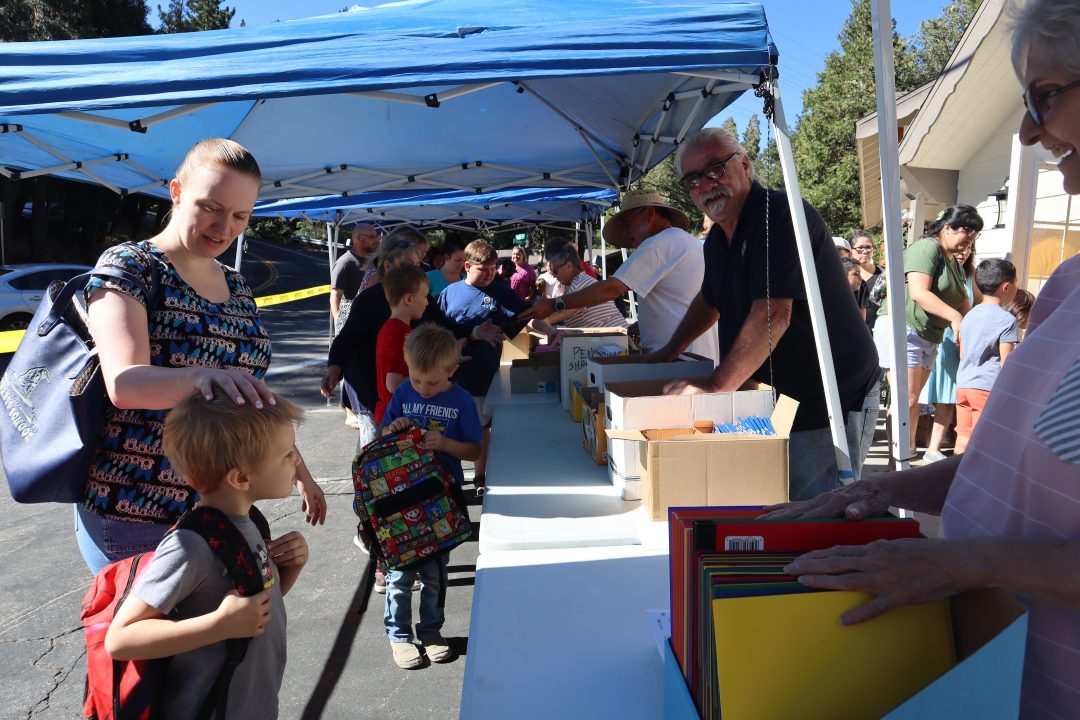 Students and their parents will line up early on Aug. 3 to choose their backpacks and fill them with school supplies.