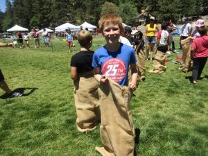 Ten-year-old Gavin Baker captured first-place honors in the potato sack race. (Photo by Douglas W. Motley)