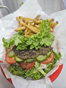 Burgers can be lettuce wrapped; all burgers come with French fries.