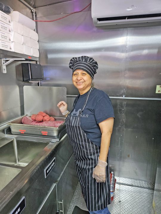 Ofelia, a retired nurse, now helps out on occasion in the Little Kitchen.