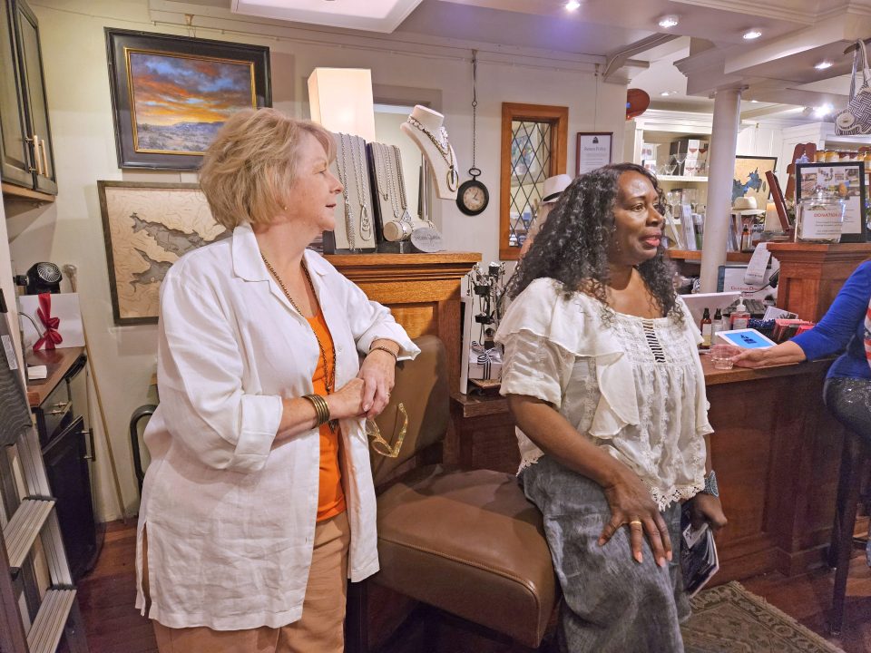 Robin Lyles (left), owner of The Lake House, listens as Chris Levister talks about the upcoming Blue Jay Jazz Festival. (Photos by Mary-Justine Lanyon)