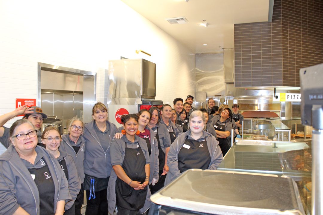 The entire deli crew at Goodwin’s Market poses as if to say, “Come try our sandwiches, cold cuts, salads and hand-made pizza.”