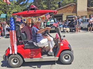 Longtime Green Valley Lake resident Sandy Ellis was all smiles as she rode in the parade.