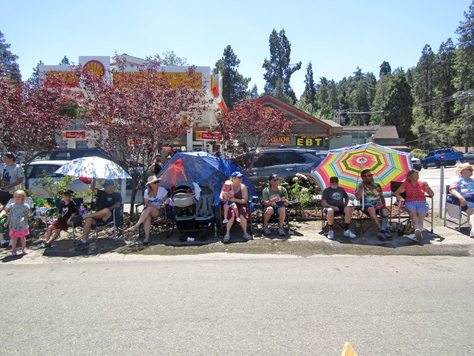 Parade goers found some shade at the Lake Drive Shell Station.