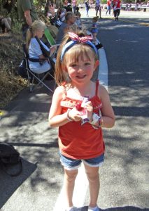 This 4-year-old lass said her favorite part of the parade, so far, was the horses parading along Lake Drive.