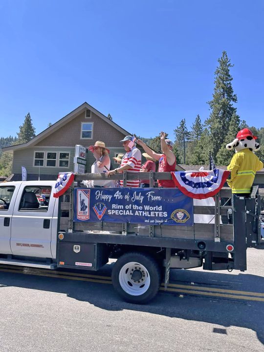 Members of the Rim Special Athletes rode in a County Fire truck in the Jamboree Days parade.