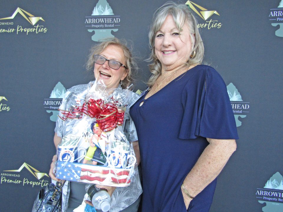 Adrianne, Lisa, Julia, Melissa and Adrianna from Glendora and Orange County enjoyed last year’s Brewfest at Tavern Bay Beach Club so much they couldn’t resist attending this year’s event. (Photos by Douglas W. Motley) Two women smiling with gift basket at event.