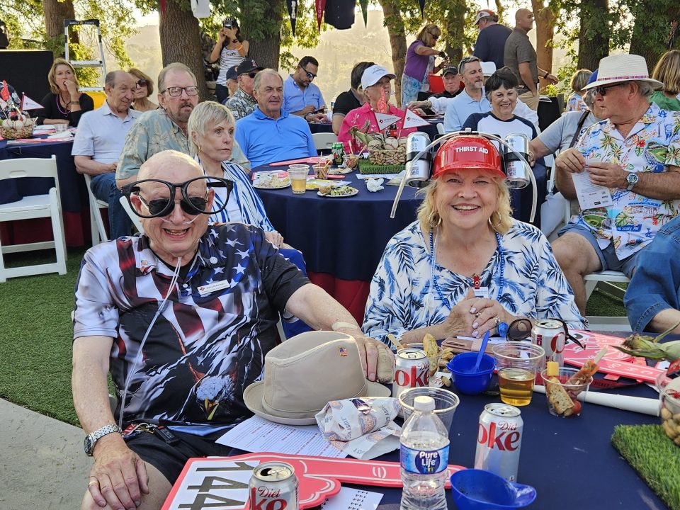 Barry and Cheryl Robinson won the “most team spirit” award for their table, receiving wacky glasses and “thirst aid” hats.
