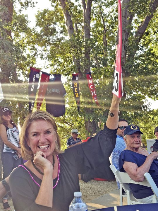 Allison Banner kept bidding on the diamond arrowhead pendant. She didn’t win it but was told she raised the bid up an extra grand.