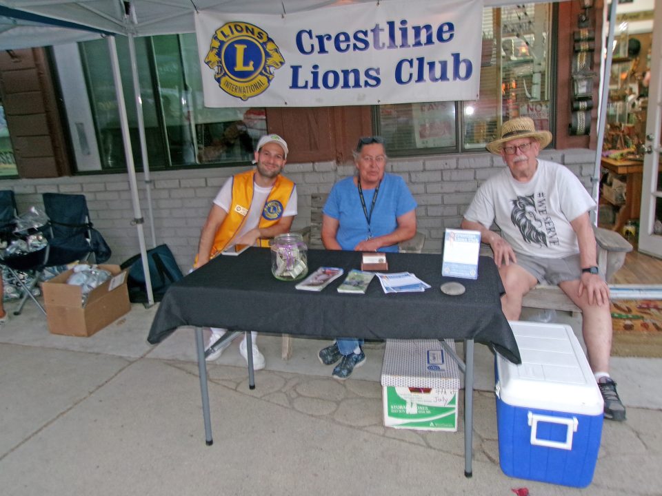 Adrianne, Lisa, Julia, Melissa and Adrianna from Glendora and Orange County enjoyed last year’s Brewfest at Tavern Bay Beach Club so much they couldn’t resist attending this year’s event. (Photos by Douglas W. Motley) Crestline Lions Club booth with three seated members.
