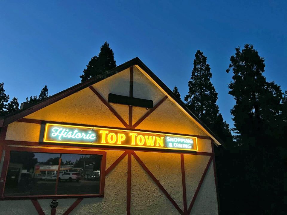 Adrianne, Lisa, Julia, Melissa and Adrianna from Glendora and Orange County enjoyed last year’s Brewfest at Tavern Bay Beach Club so much they couldn’t resist attending this year’s event. (Photos by Douglas W. Motley) Historic Top Town shopping and dining sign at dusk