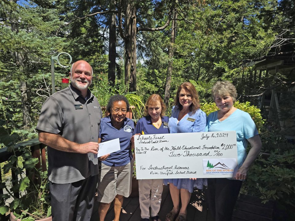 Adrianne, Lisa, Julia, Melissa and Adrianna from Glendora and Orange County enjoyed last year’s Brewfest at Tavern Bay Beach Club so much they couldn’t resist attending this year’s event. (Photos by Douglas W. Motley) Group holding oversized donation check outdoors.