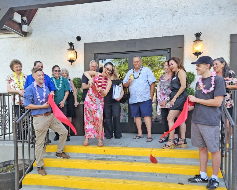 Adrianne, Lisa, Julia, Melissa and Adrianna from Glendora and Orange County enjoyed last year’s Brewfest at Tavern Bay Beach Club so much they couldn’t resist attending this year’s event. (Photos by Douglas W. Motley) Group at ribbon-cutting ceremony outside a building.