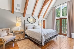 This bedroom, which features French doors, large windows and high ceilings, was designed for former Governor Brown by the original owner.