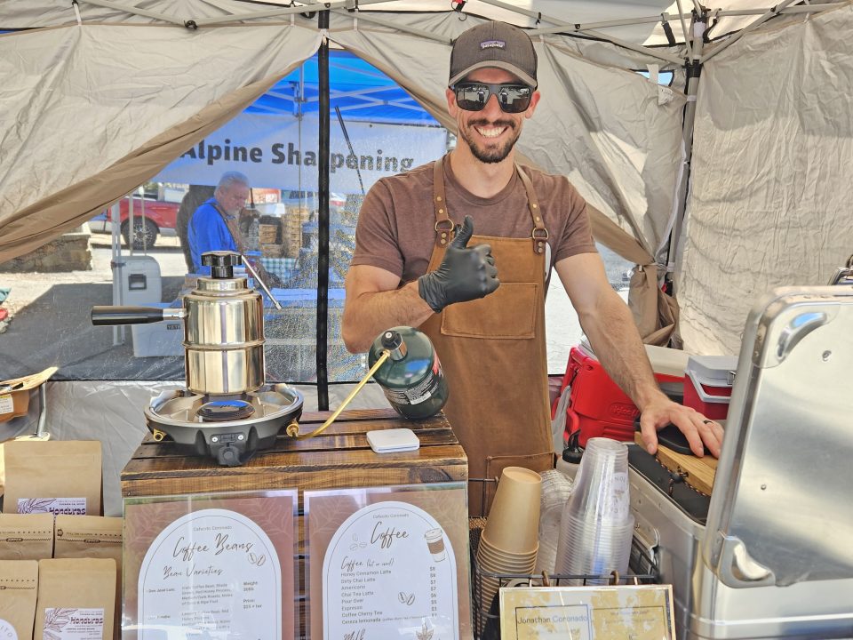 Adrianne, Lisa, Julia, Melissa and Adrianna from Glendora and Orange County enjoyed last year’s Brewfest at Tavern Bay Beach Club so much they couldn’t resist attending this year’s event. (Photos by Douglas W. Motley) Barista in apron serves coffee at market stall.