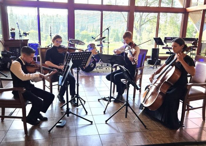 Adrianne, Lisa, Julia, Melissa and Adrianna from Glendora and Orange County enjoyed last year’s Brewfest at Tavern Bay Beach Club so much they couldn’t resist attending this year’s event. (Photos by Douglas W. Motley) String quartet playing in a sunlit room.