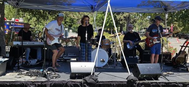 Adrianne, Lisa, Julia, Melissa and Adrianna from Glendora and Orange County enjoyed last year’s Brewfest at Tavern Bay Beach Club so much they couldn’t resist attending this year’s event. (Photos by Douglas W. Motley) Outdoor band performance under blue canopy.