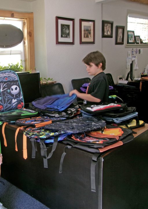 Inside the office with the selection of backpacks.