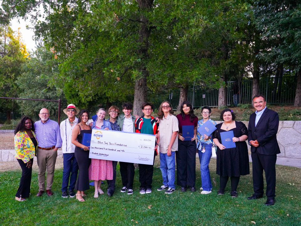 Nine of the 10 Future Generation Jazz scholars with Chris Levister, Lewis Murray, Hugh Bialecki and Ted Alejandre. The students hold the $2,500 donation from Supervisor Dawn Rowe. (Photo by Dylan Wood)
