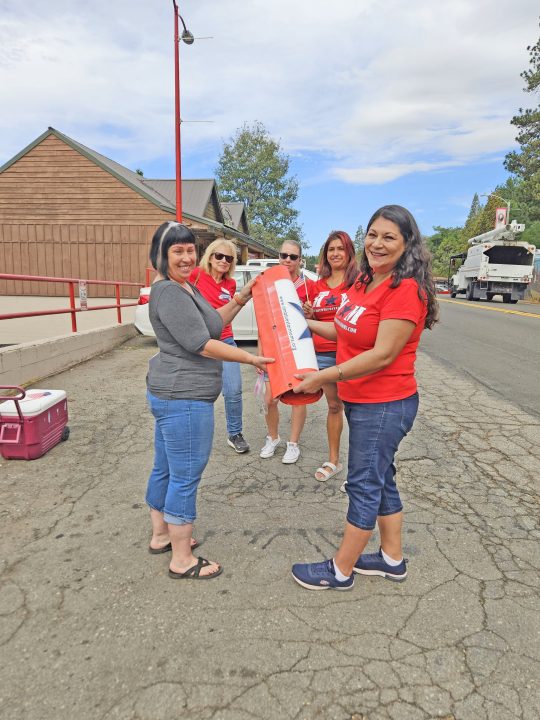 Adrianne, Lisa, Julia, Melissa and Adrianna from Glendora and Orange County enjoyed last year’s Brewfest at Tavern Bay Beach Club so much they couldn’t resist attending this year’s event. (Photos by Douglas W. Motley) Women holding life preserver in parking lot
