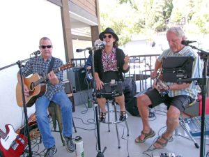 Shannon Bizzy with John Golden and Dave Bennett provided entertainment at the grand reopening of Goodwin’s. (Photo by Rhea-Frances Tetley)