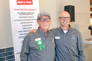 Goodwin’s Market’s president, David Goodwin, left, and his nephew, Goodwin’s vice president, Mike Johnstone, share a moment during grand reopening ceremonies.