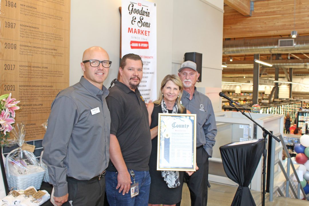 Third District County Supervisor Dawn Rowe holds a county resolution congratulating Goodwin’s Market for reopening following a disastrous roof collapse from the March 2023 snowstorms. From left, Goodwin’s vice president, Mike Johnstone; county regional building inspector Jeremy Griffith; Supervisor Rowe; and Goodwin’s president, David Goodwin.