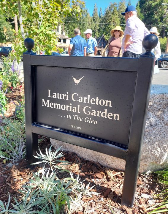 Adrianne, Lisa, Julia, Melissa and Adrianna from Glendora and Orange County enjoyed last year’s Brewfest at Tavern Bay Beach Club so much they couldn’t resist attending this year’s event. (Photos by Douglas W. Motley) Lauri Carleton Memorial Garden sign with people nearby.