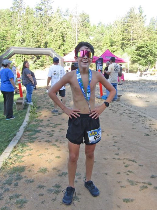 Leonides Hernandez, 15, from Fontana, the second runner to cross the finish line, captured third place in his age group.