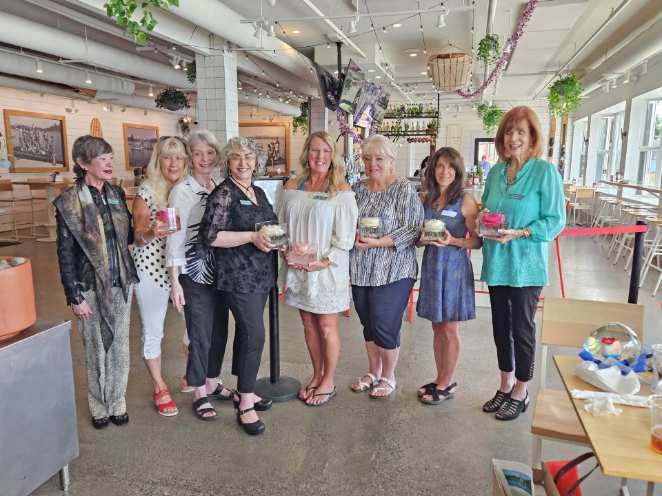 Group of women smiling in a restaurant.