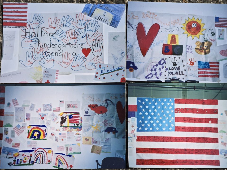 Patriotic children's drawings and American flag display.