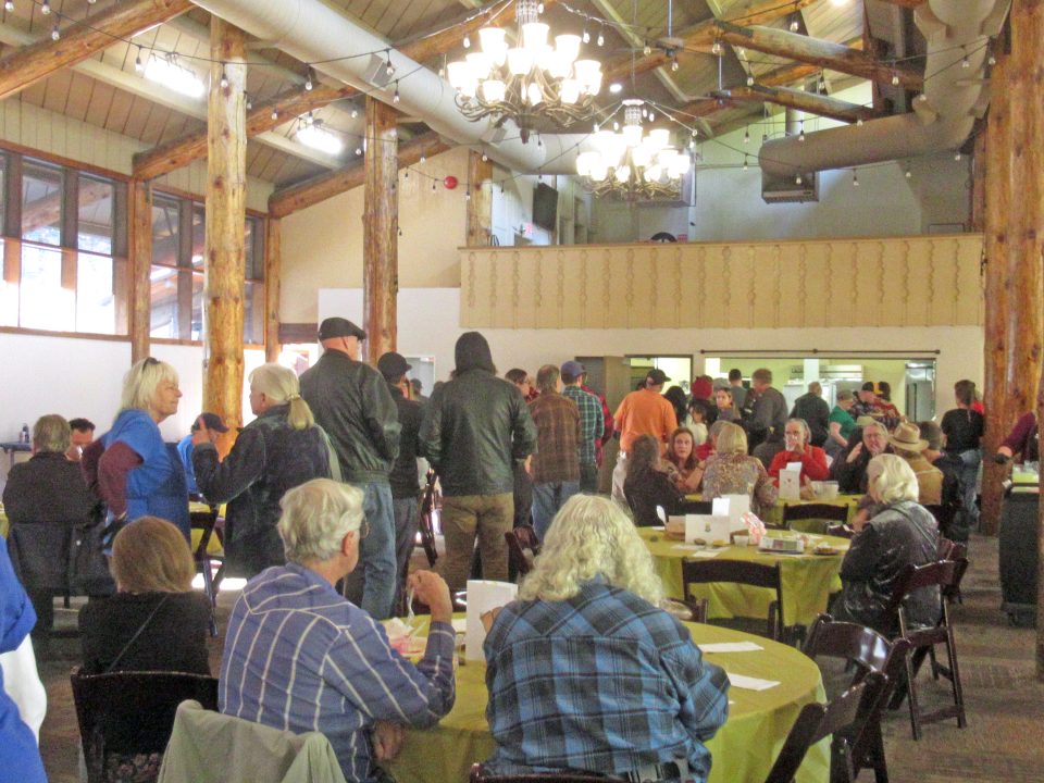 Adrianne, Lisa, Julia, Melissa and Adrianna from Glendora and Orange County enjoyed last year’s Brewfest at Tavern Bay Beach Club so much they couldn’t resist attending this year’s event. (Photos by Douglas W. Motley) Community gathering in rustic hall with people dining.