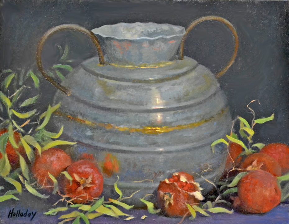 Metal pot with pomegranates and green leaves