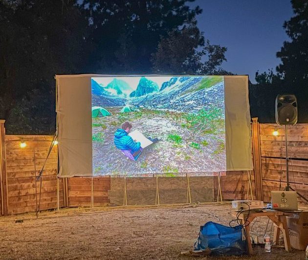 Adrianne, Lisa, Julia, Melissa and Adrianna from Glendora and Orange County enjoyed last year’s Brewfest at Tavern Bay Beach Club so much they couldn’t resist attending this year’s event. (Photos by Douglas W. Motley) Outdoor movie screen displaying mountain camping scene