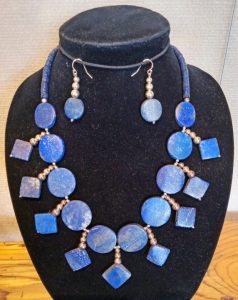 Lapis lazuli and sterling silver make up this spectacular set of pierced earrings and statement necklace