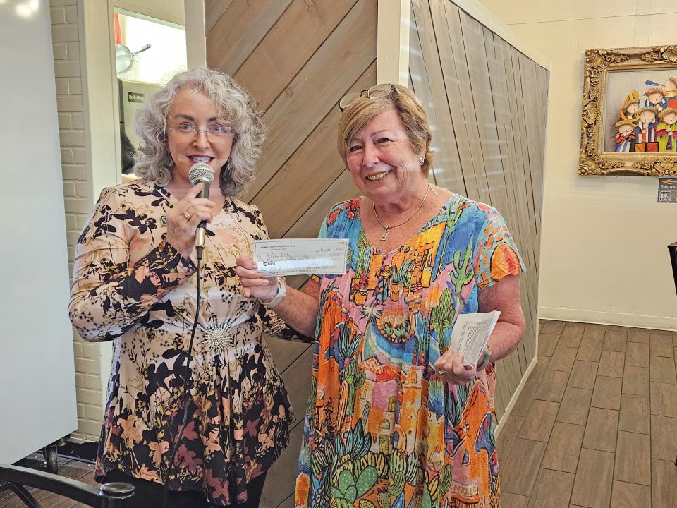 Adrianne, Lisa, Julia, Melissa and Adrianna from Glendora and Orange County enjoyed last year’s Brewfest at Tavern Bay Beach Club so much they couldn’t resist attending this year’s event. (Photos by Douglas W. Motley) Two women holding a check, smiling indoors.