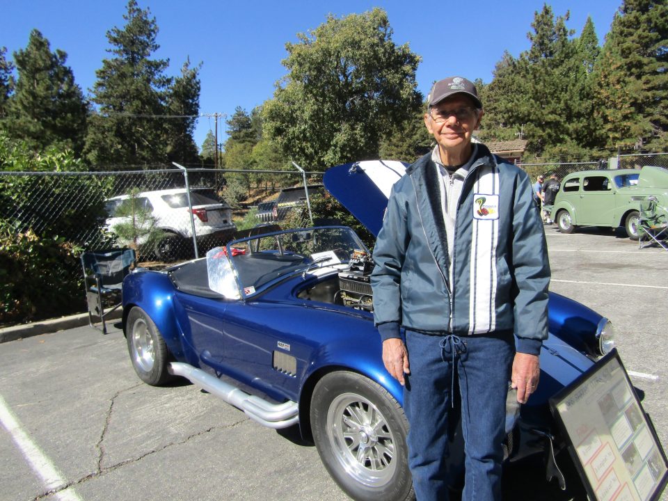 Adrianne, Lisa, Julia, Melissa and Adrianna from Glendora and Orange County enjoyed last year’s Brewfest at Tavern Bay Beach Club so much they couldn’t resist attending this year’s event. (Photos by Douglas W. Motley) Man stands beside classic blue sports car.