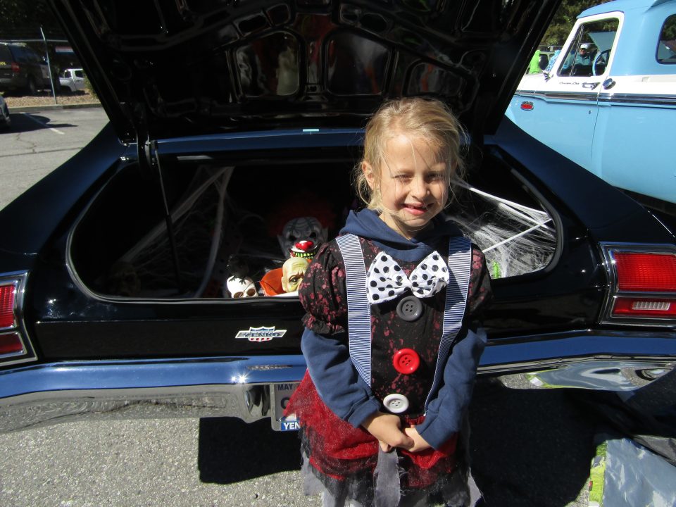 Jane, who is a second-grader at Charles Hoffman Elementary School, is ready for Halloween as she stands behind her daddy’s 1969 Chevelle.