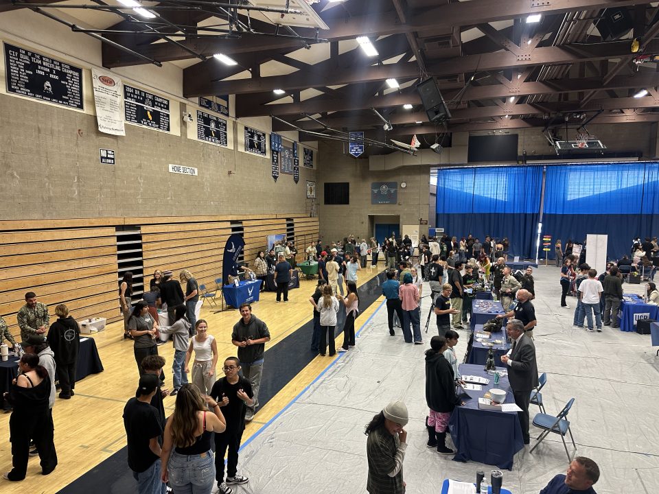 The gym at Rim of the World High School was bustling with activity as students talked with the multitude of vendors who participated in the College and Career Fair.