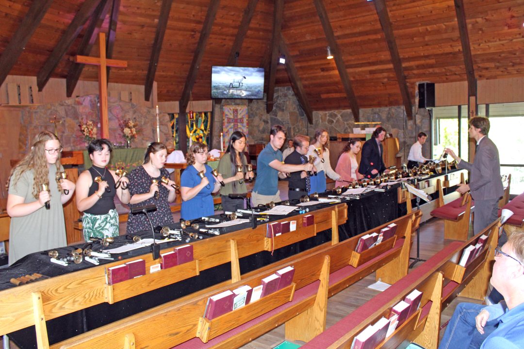 Adrianne, Lisa, Julia, Melissa and Adrianna from Glendora and Orange County enjoyed last year’s Brewfest at Tavern Bay Beach Club so much they couldn’t resist attending this year’s event. (Photos by Douglas W. Motley) People playing handbells in a wooden church.