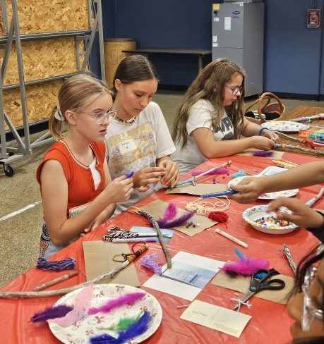 Paige, Wren and Evalyn hard at work making their talking sticks.