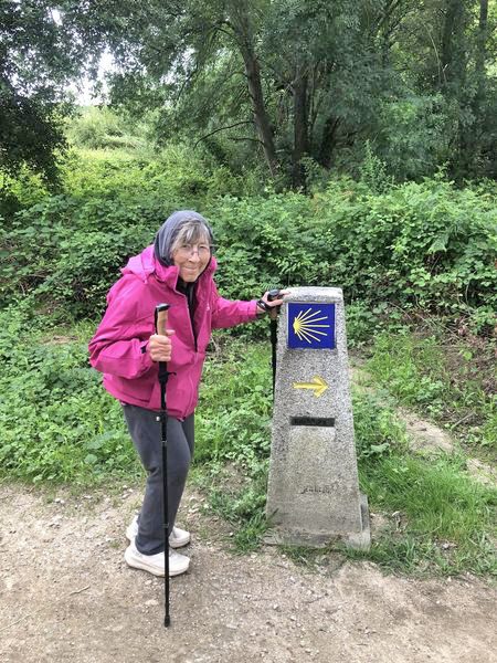 Ethel and an El Camino path marker. (Photo by Fritz Ward)