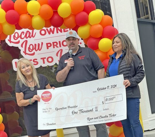 Adrianne, Lisa, Julia, Melissa and Adrianna from Glendora and Orange County enjoyed last year’s Brewfest at Tavern Bay Beach Club so much they couldn’t resist attending this year’s event. (Photos by Douglas W. Motley) Three people presenting a large donation check.