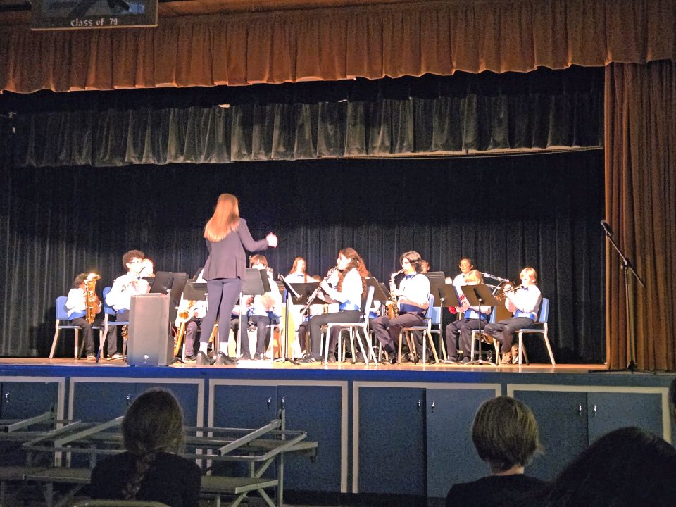 Adrianne, Lisa, Julia, Melissa and Adrianna from Glendora and Orange County enjoyed last year’s Brewfest at Tavern Bay Beach Club so much they couldn’t resist attending this year’s event. (Photos by Douglas W. Motley) School band performing on stage with conductor.