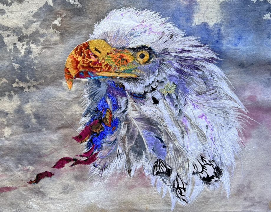 Look to the Skies, 22” x 28” thread-painted mixed-media textile by Debbie Pekarcik (a gift to her son, Daniel).